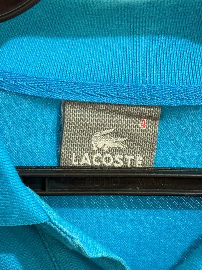 Lacoste Blue Polo Shirt (Category: Tshirts & Polo Shirts ) located in Quezon City. Submitted by artdeclutters_ (Listing ID 1413924050, Image 3). Description: Rfs: Not using anymore, decluttering DM for Dimensions MoP: GCash/Cash Courier: To be booked by buyer/available for pick-up More details: - Authentic Lacoste polo shirt - Vibrant turqoise blue color - Size 4 - Iconic Lacoste crocodile logo - Classic polo collar and short sleeves - Comfortabl