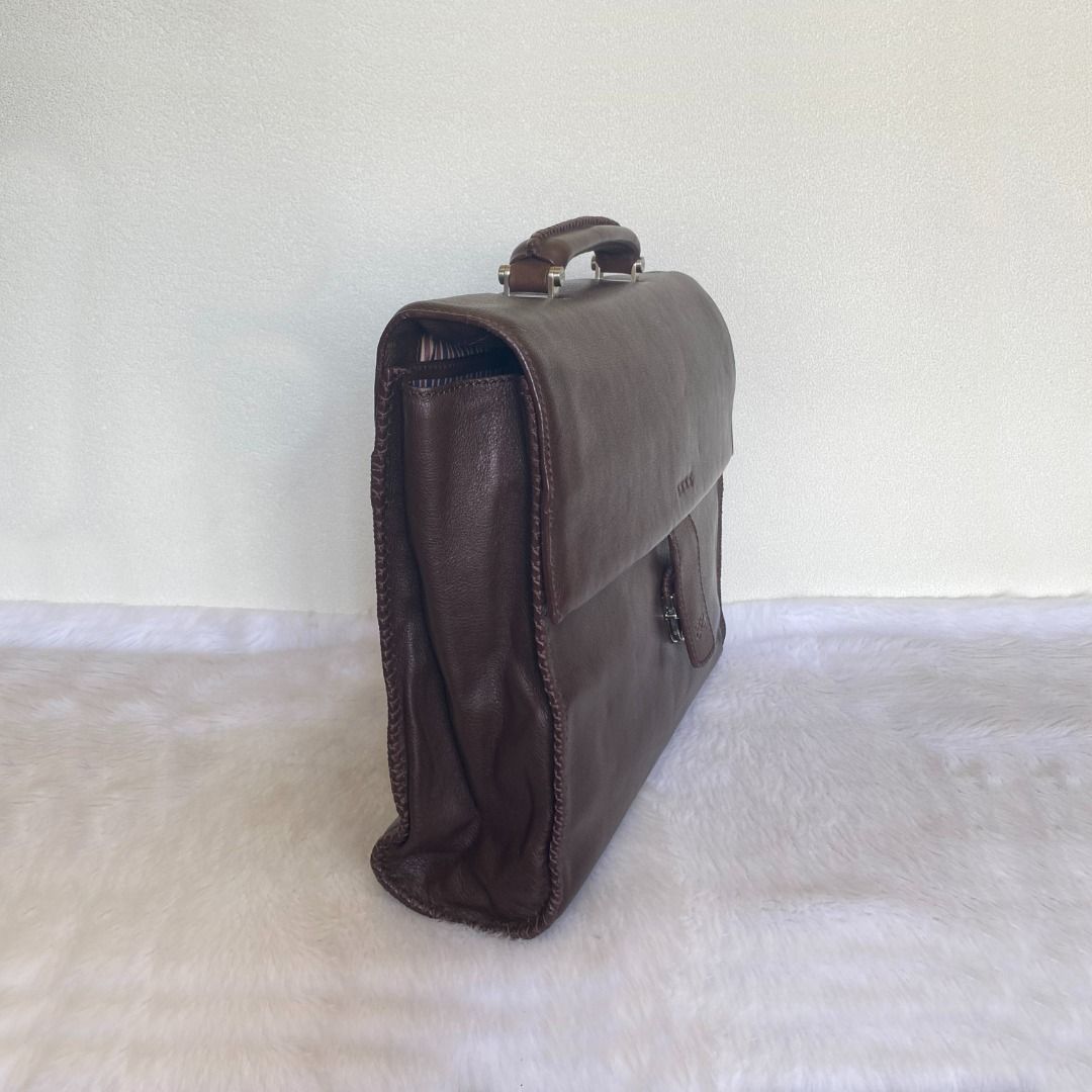 Lancel Brown Leather Document Bag Briefcase (Category: Briefcases) located in Cebu City. Submitted by posh_avenue888 (Listing ID 1414013960, Image 2). Description: In very good condition showing light signs of wear. Crafted in genuine leather. 100% authentic or your money back!!! Measurements (taken flat - approximate): Length: 14 inches; Height: 12 inches; Depth: 2.5 inches. .