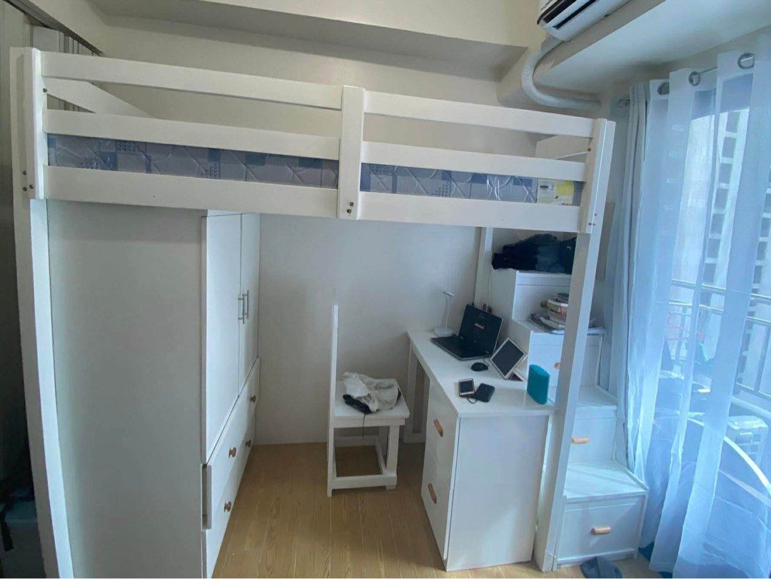 Loft Bed with Desk, Wardrobe, and Drawers (Category: Bed Frames & Mattresses) located in Manila. Submitted by gagabs (Listing ID 1414022726, Image 2). Description: White loft bed - JUST THE LOFT BED (table and cabinet not included) - Needs Cleaning/Repainting (WELL USED) - Staircase with drawers - Maximizes space - Mattress included - Originally bought for ₱50k custom order (w the cabinet and table) - Material is mahogany - RUSHHH price is slight