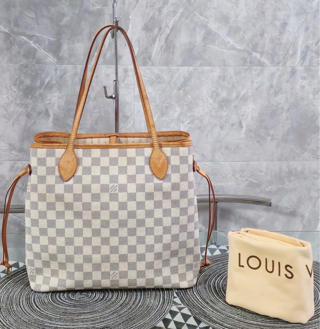 Louis Vuitton Damier Azur Neverfull MM (Category: Luxury Bags & Wallets) located in Caloocan City. Submitted by lujosacollection (Listing ID 1414036836, Image 2). Description: Guaranteed Authentic/Original Preloved Louis Vuitton Damier Azur Neverfull MM In very good condition With dustbag Free bag organizer.
