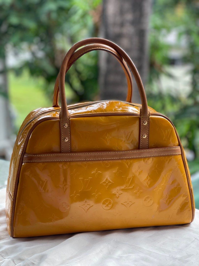 Louis Vuitton Vernis Deauville (Category: Luxury Bags & Wallets) located in San Fernando. Submitted by wayweworeph (Listing ID 1413861508, Image 1). Description: - Authentic Louis Vuitton Deauville handbag - Stunning mustard yellow color - Glossy Vernis leather with LV monogram - Secure top zipper closure - Comfortable double handles - Includes a small padlock - Matching yellow leather interior - Made in France -bought in Japan in the early 200s 