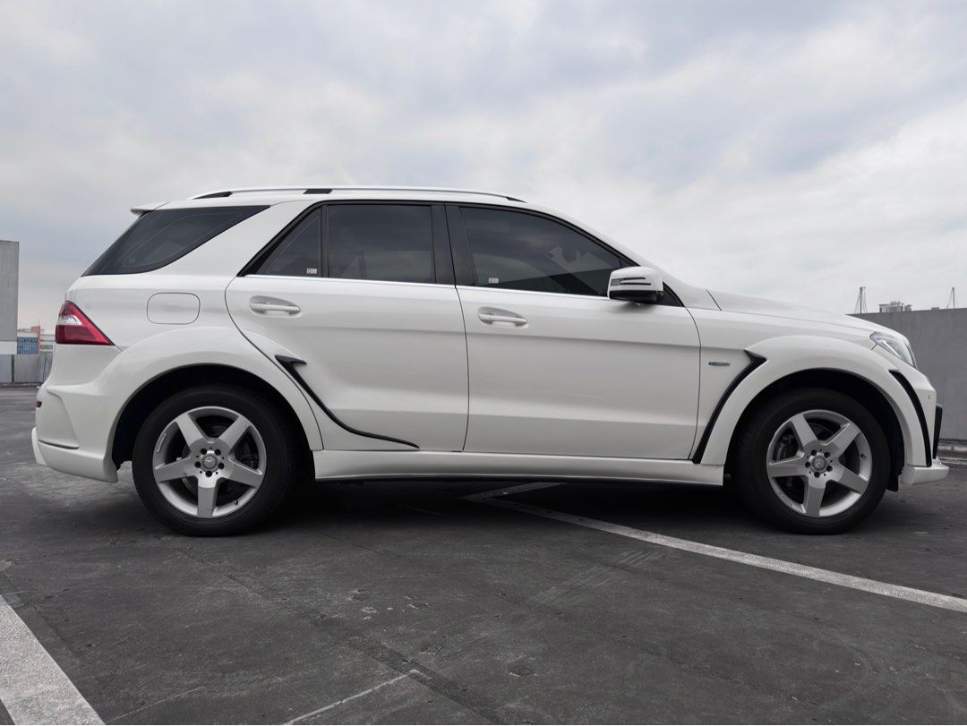 Mercedes-Benz ML350 4Matic (A) (Category: New Cars) located in Pasig City. Submitted by gtautoph (Listing ID 1413876792, Image 3). Description: ⬛️🟥🟨 FOR SALE 🟨🟥⬛️ 2012 Mercedes Benz ML350d AMG 4MATIC All-Wheel Drive 3.0-liter V6 Blue Efficiency Turbo Diesel 28k Kilometers ONLY WALD Black Bison Edition 7-speed Automatic Transmission Leather Interior Retractable Cargo Cover Plate # Ending: 8 📩 DM for further assistance 📍 Location: Ortigas, Pa