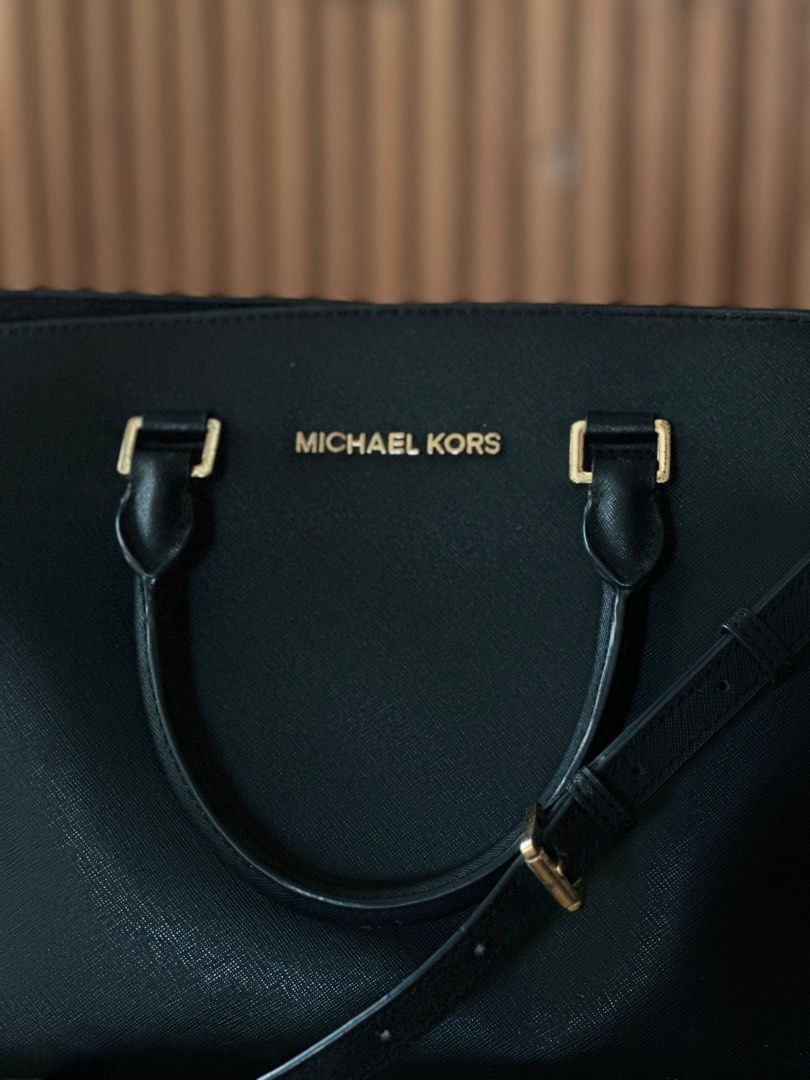 MK Selma Large (Category: Luxury Bags & Wallets) located in Quezon City. Submitted by _mgnmn (Listing ID 1413982415, Image 2). Description: Tarnishing zipper and metal hardware on straps Back panel, slightly deformed Overall, the bag it self is in good condition.