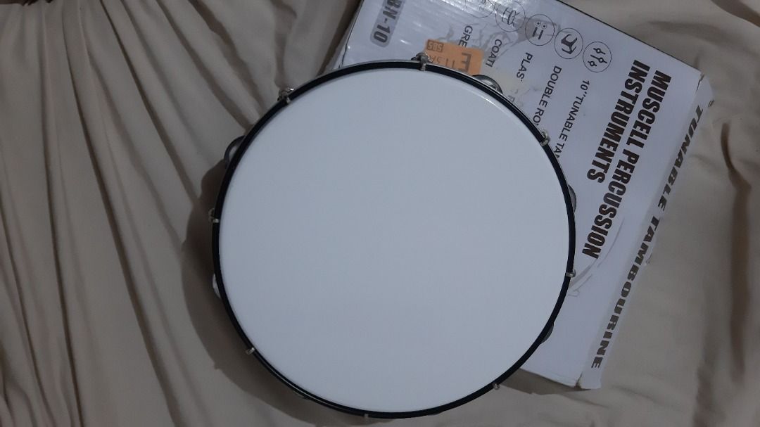 Muscell Percussion 10-inch Tambourine (Category: Musical Instruments) located in Cainta. Submitted by alpaca19 (Listing ID 1413874968, Image 3). Description: - Muscell Percussion Tambourine - 10-inch tunable design - White drumhead - Wooden frame - Metal jingles - Double row jingles - Perfect for adding percussion to your music!.