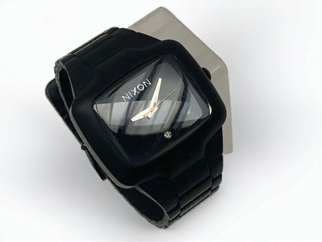 Nixon The Rubber Player Watch (with Real Diamond) (Category: Men's Watches) located in General Trias. Submitted by lexluxebizz (Listing ID 1413893397, Image 3). Description: NIXON Rubber Player Watch (with REAL DIAMOND) 100% Authentic (Purchased at the Bloomingdales Store in Dubai Mall) PRE-OWNED Product Description: - MOVEMENT: Miyota Japanese Quartz 3 Hand - DIAL: The dial is surrounded by a concave dial ring and includes a REAL DIAMOND set at 