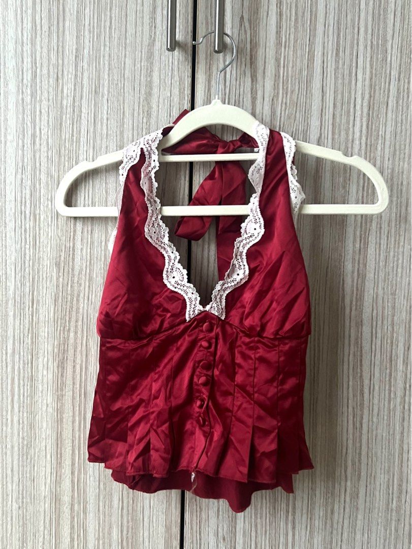 [ONHAND] Pacsun ~ Bella Lace Trim Halter Top Red (Category: Sleeveless) located in Cebu City. Submitted by angel.energyph2 (Listing ID 1413887151, Image 1). Description: 🏷️ ₱1200 Size XS Waist 33-34” Hip 25-26” - Brand new without tag - Silky woven fabric - Plunging v-neckline with lace trim - Button front placket - Pleated bodice with ruffled hem - Open back design - Adjustable halter strap - Smocked back detail - Slightly cropped length.