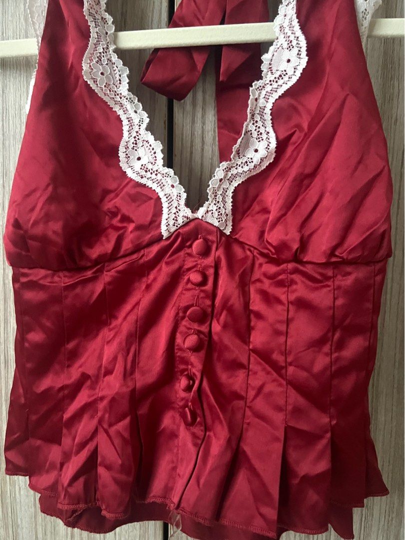 [ONHAND] Pacsun ~ Bella Lace Trim Halter Top Red (Category: Sleeveless) located in Cebu City. Submitted by angel.energyph2 (Listing ID 1413887151, Image 2). Description: 🏷️ ₱1200 Size XS Waist 33-34” Hip 25-26” - Brand new without tag - Silky woven fabric - Plunging v-neckline with lace trim - Button front placket - Pleated bodice with ruffled hem - Open back design - Adjustable halter strap - Smocked back detail - Slightly cropped length.