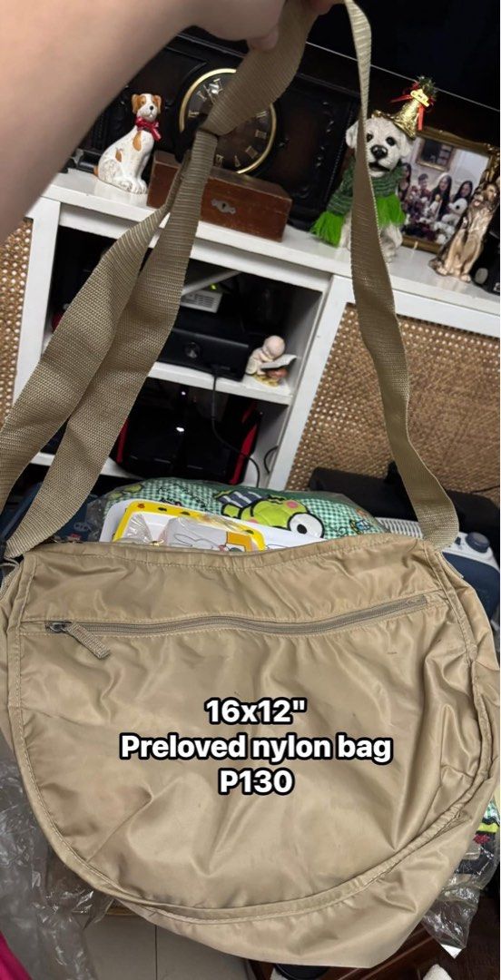 Preloved Nylon Bag 16x12" (Category: Luxury Bags & Wallets) located in Mandaluyong City. Submitted by elainelawenko (Listing ID 1414030769, Image 1). Description: - Pre-owned nylon bag - Neutral color - Zippered closure - Shoulder strap - Dimensions: 16x12 inches - Single interior compartment - Minor marks on exterior - Perfect for daily use.