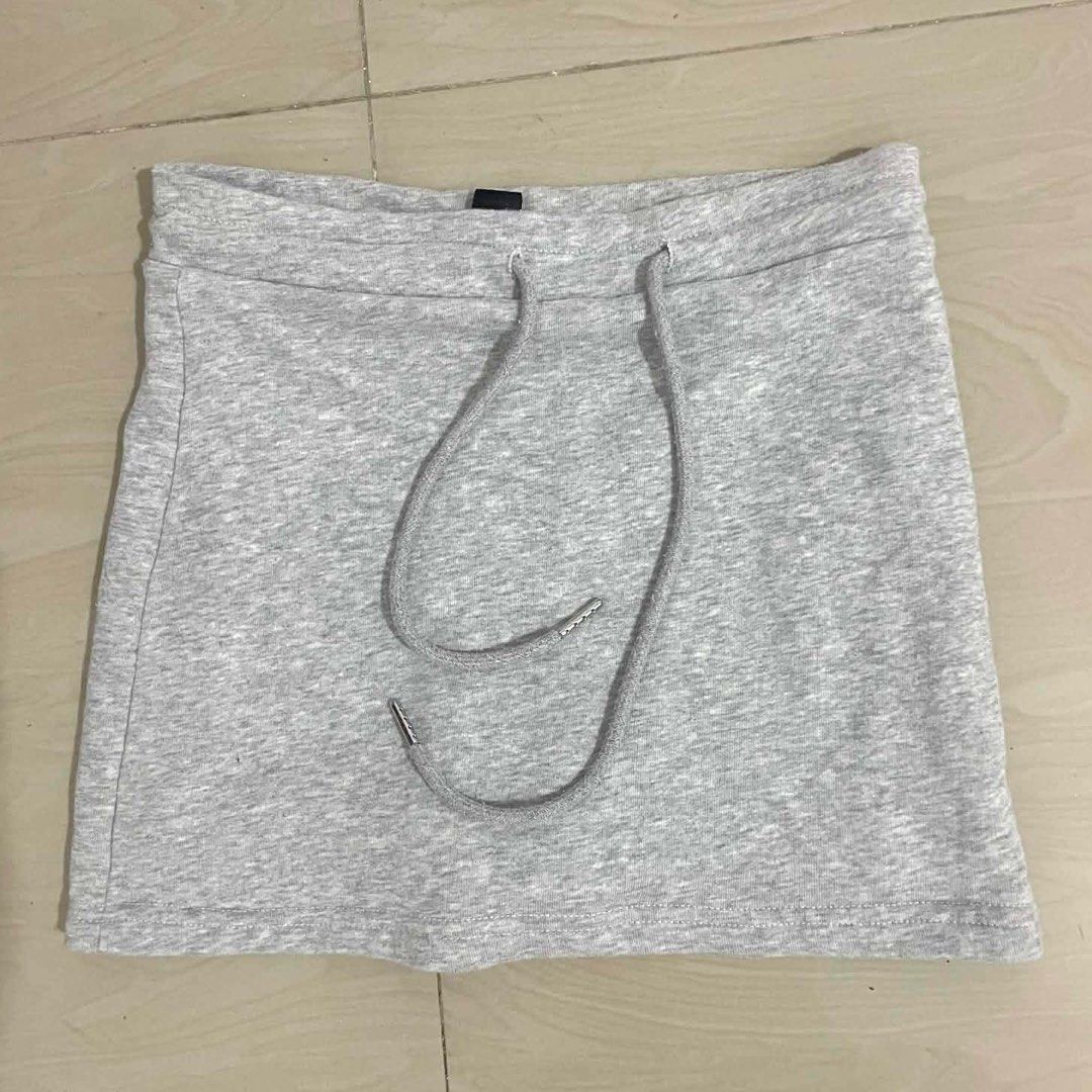 SWAP/SALE Shein Grey Mini Skirt with Drawstring (Category: Skirts) located in Manila. Submitted by soleaj (Listing ID 1413905949, Image 1). Description: Light grey mini skirt with drawstring waist. Simple, versatile design. Soft, comfortable fabric. xs to small 23 inch superr mini skirrt!! bought this for 500 php.