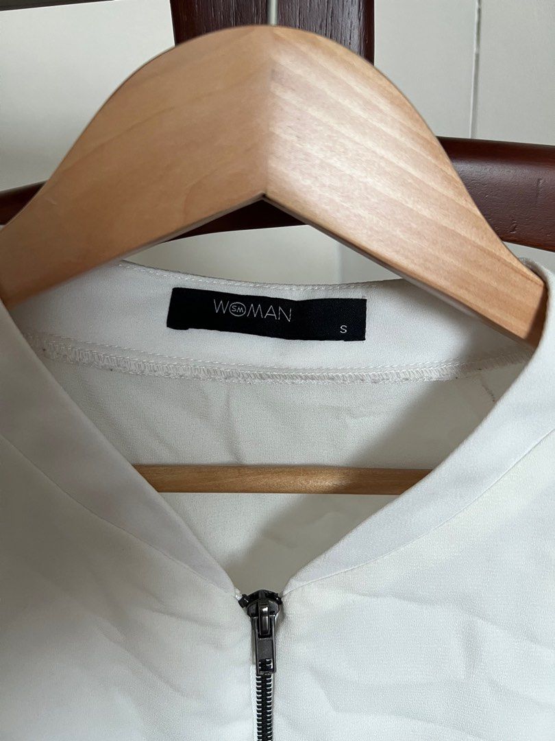 SM Woman White Bomber Jacket - Size S (Category: Coats, Jackets and Outerwear) located in Manila. Submitted by okgreat (Listing ID 1413860904, Image 3). Description: - Woman white bomber jacket - Size: S - Features a zip-up front - Long sleeves - Ribbed hem - Simple, clean design - Versatile for various outfits.