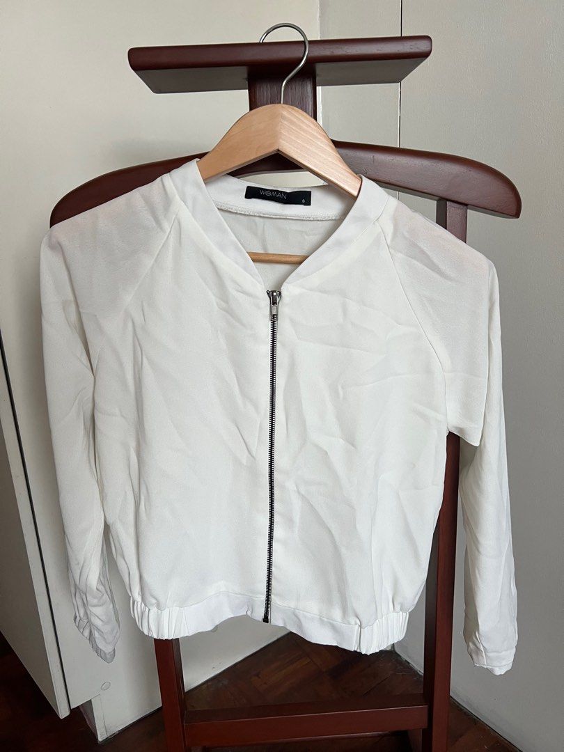 SM Woman White Bomber Jacket - Size S (Category: Coats, Jackets and Outerwear) located in Manila. Submitted by okgreat (Listing ID 1413860904, Image 1). Description: - Woman white bomber jacket - Size: S - Features a zip-up front - Long sleeves - Ribbed hem - Simple, clean design - Versatile for various outfits.