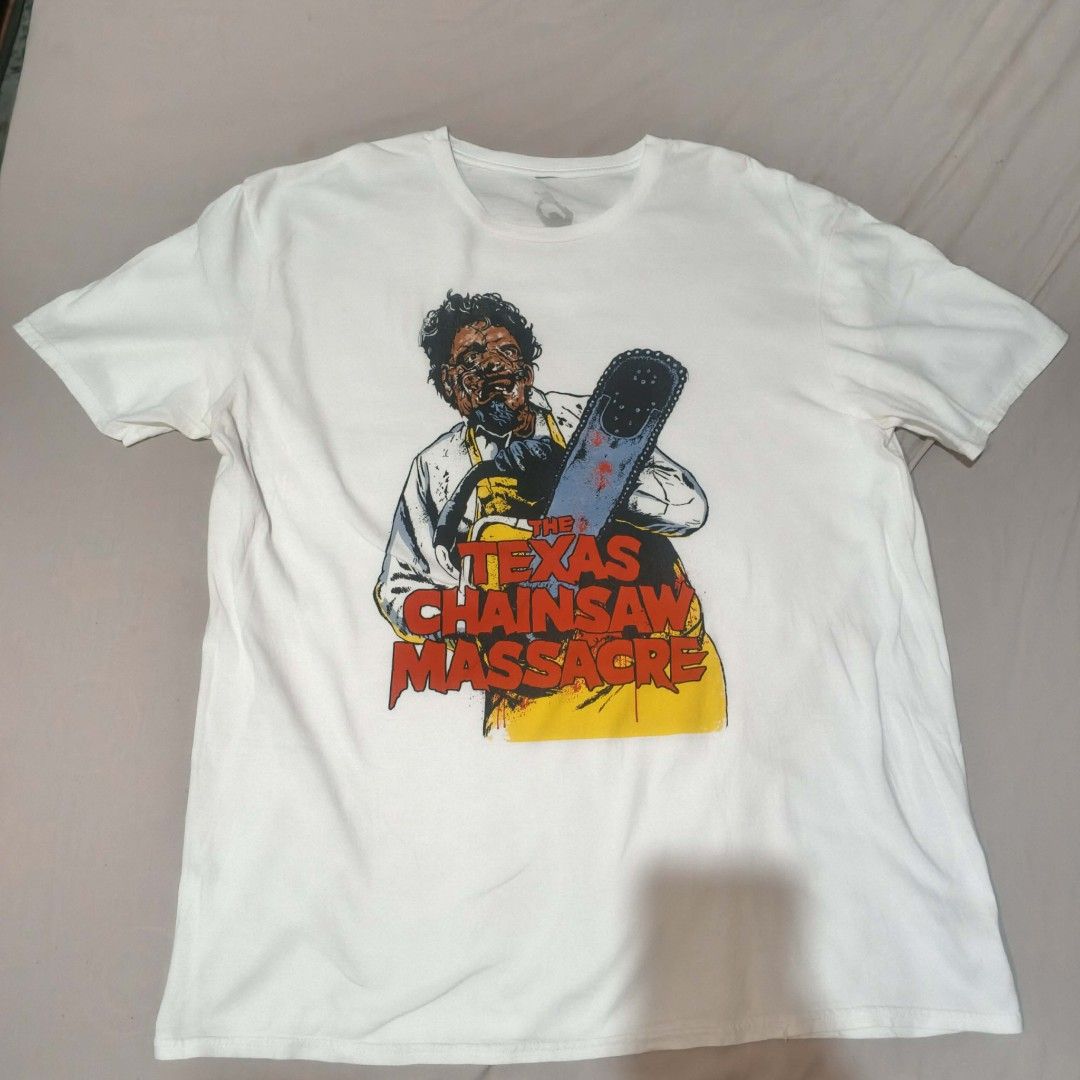 The Texas Chainsaw Massacre Graphic Tee 30/22 (Category: Tshirts & Polo Shirts ) located in Manila. Submitted by justincari62724 (Listing ID 1413998306, Image 1). Description: - The Texas Chainsaw Massacre graphic tee. - Features a bold graphic on the front. - Design: Character with chainsaw and movie title. - Style: Crew neck. 30/22.
