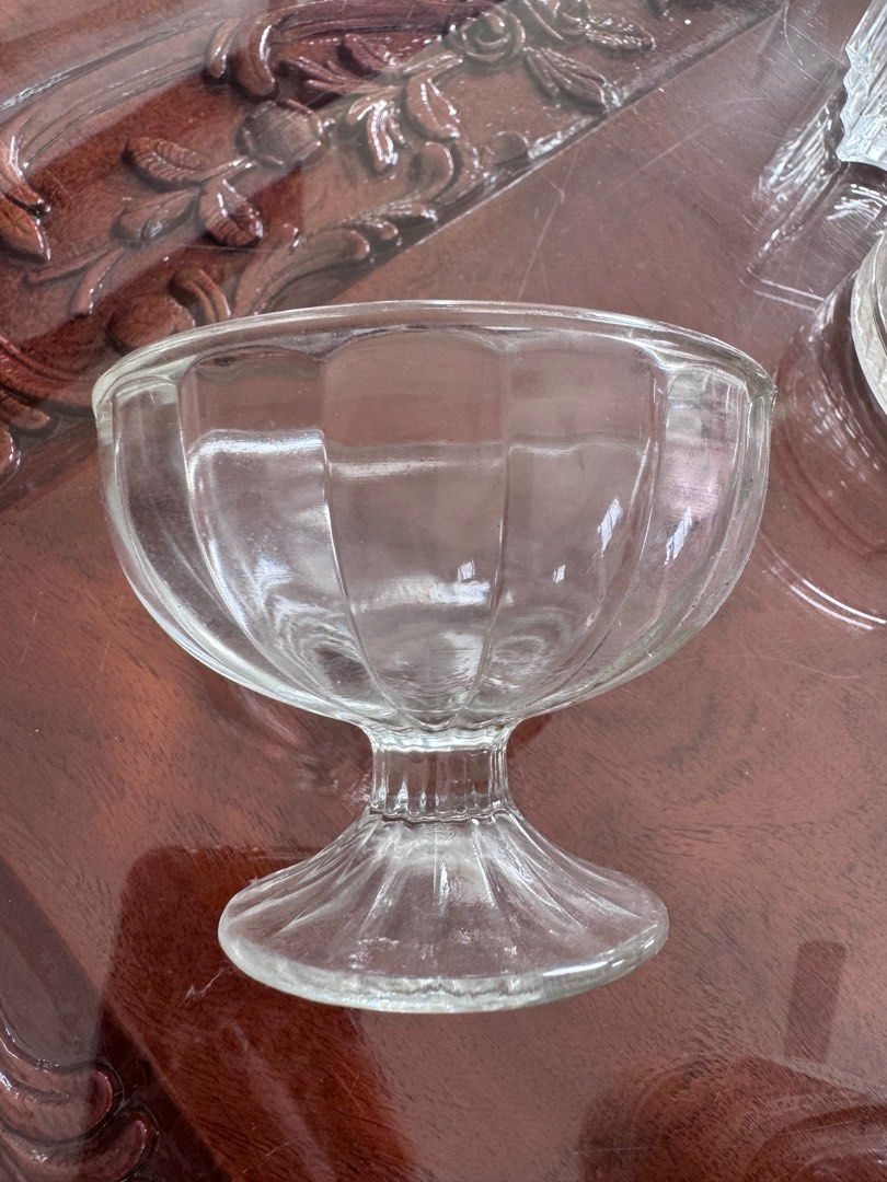 Vintage Clear Glass Dessert Cups (Category: Coffee & Tea Tableware) located in Manila. Submitted by decluterthings888 (Listing ID 1413881853, Image 2). Description: - Set of clear glass dessert cups - Features a ribbed design on the bowl and stem - Perfect for serving ice cream, parfaits, or other sweet treats - Classic and elegant look - Great addition to your kitchenware.