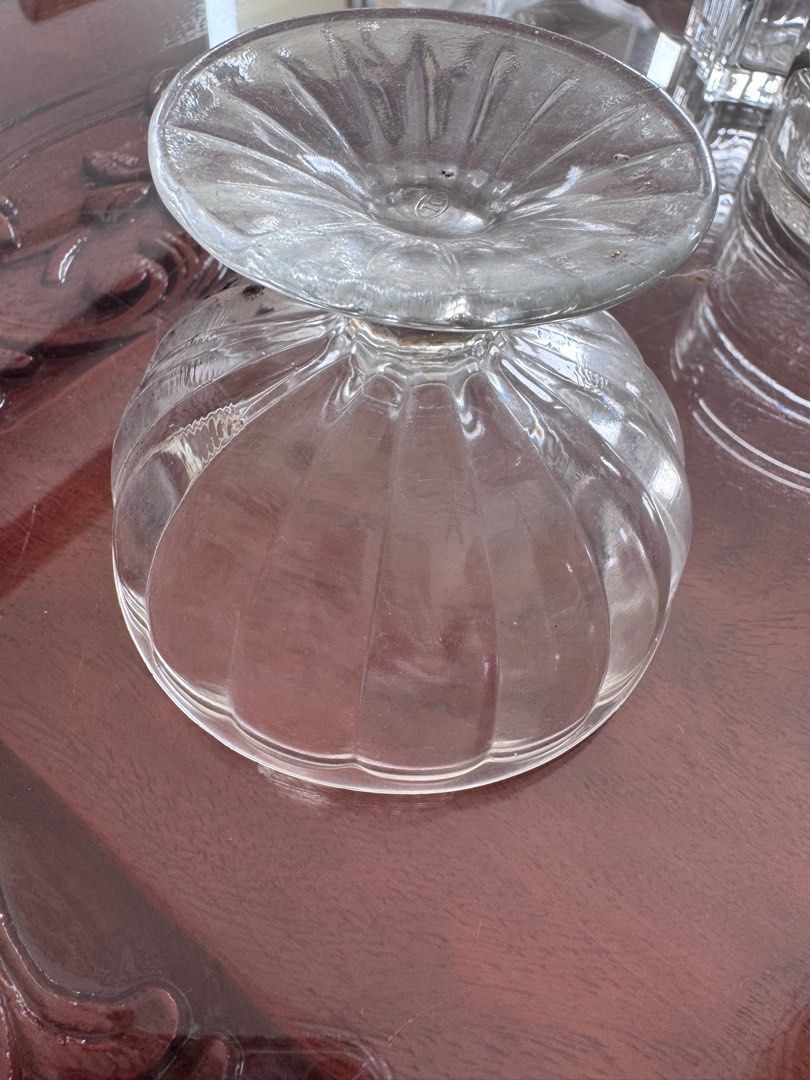 Vintage Clear Glass Dessert Cups (Category: Coffee & Tea Tableware) located in Manila. Submitted by decluterthings888 (Listing ID 1413881853, Image 1). Description: - Set of clear glass dessert cups - Features a ribbed design on the bowl and stem - Perfect for serving ice cream, parfaits, or other sweet treats - Classic and elegant look - Great addition to your kitchenware.