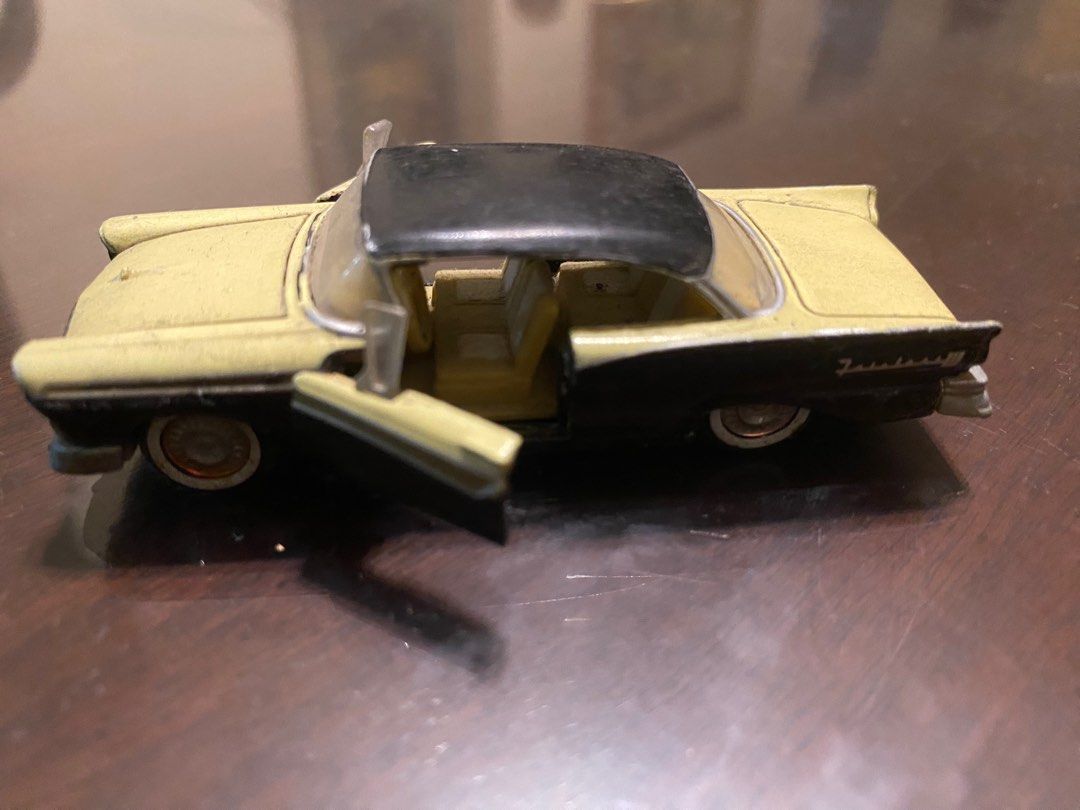 Vintage Ford Thunderbird Toy Car (Category: Vehicle & Diecast Models) located in Pasig City. Submitted by ecochicsales (Listing ID 1413881839, Image 2). Description: - Vintage Ford Thunderbird toy car - Black roof and two-tone body - Doors open - Made in China markings - Metal body construction - White-walled tires - Classic collectible item.