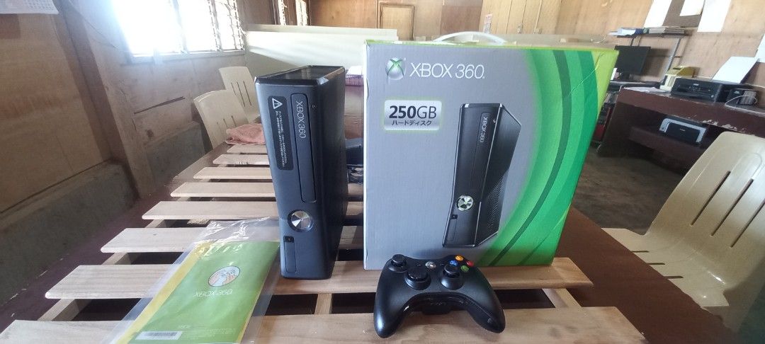 Xbox 360 250GB Console with Controller (Category: Xbox) located in Impasugong. Submitted by sid_the_adorable (Listing ID 1414048811, Image 3). Description: Xbox 360 console with a 250GB hard drive. Includes one black controller, power adapter, and the original box. Also includes a game disc. The console has been tested and is working. Several games are installed on the console, including Resident Evil 4, and more. see pics for games box is good c