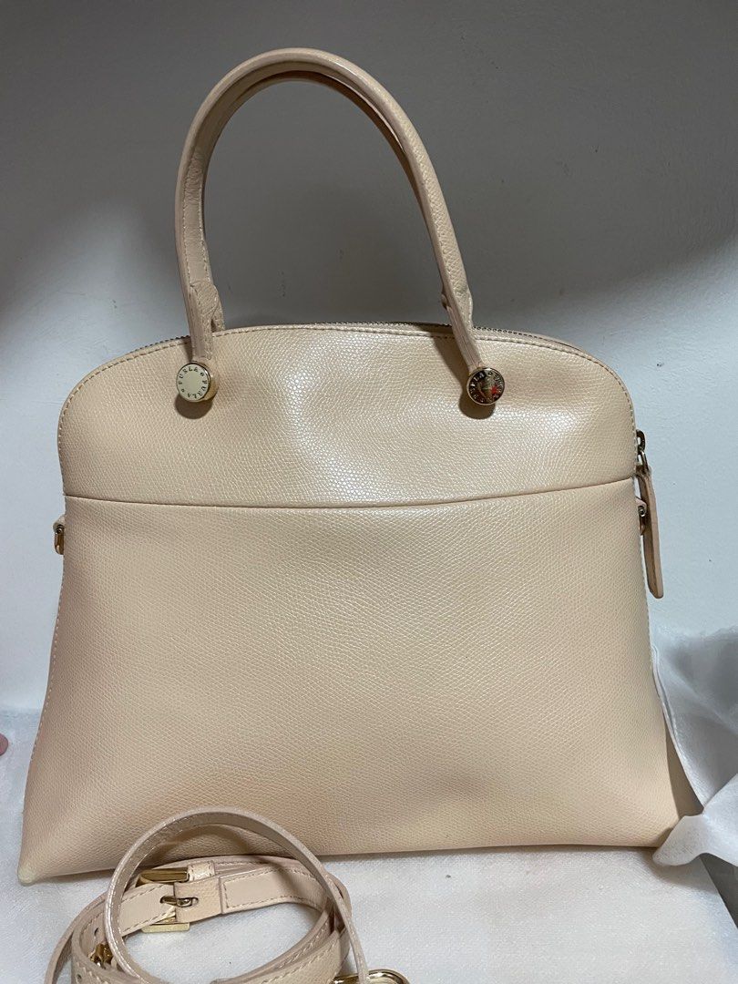 Authentic Furla Piper Dome Handbag with Shoulder Strap (Category: Luxury Bags & Wallets) located in Guiguinto. Submitted by prelovedinc2024 (Listing ID 1414176019, Image 3). Description: guaranteed authentic, bought in Japan with signs of use - rubs on corners, cracks on rubber lining (handle) fadings on gold hardwares clean size:approx 11x9x5”.