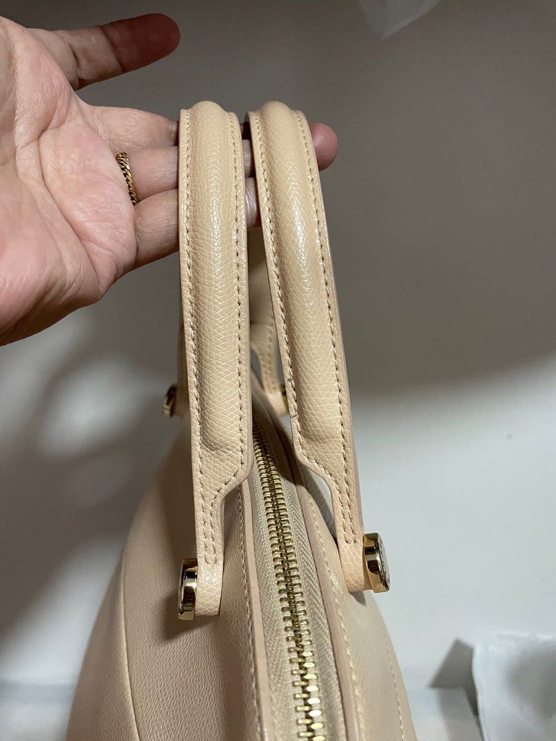 Authentic Furla Piper Dome Handbag with Shoulder Strap (Category: Luxury Bags & Wallets) located in Guiguinto. Submitted by prelovedinc2024 (Listing ID 1414176019, Image 2). Description: guaranteed authentic, bought in Japan with signs of use - rubs on corners, cracks on rubber lining (handle) fadings on gold hardwares clean size:approx 11x9x5”.
