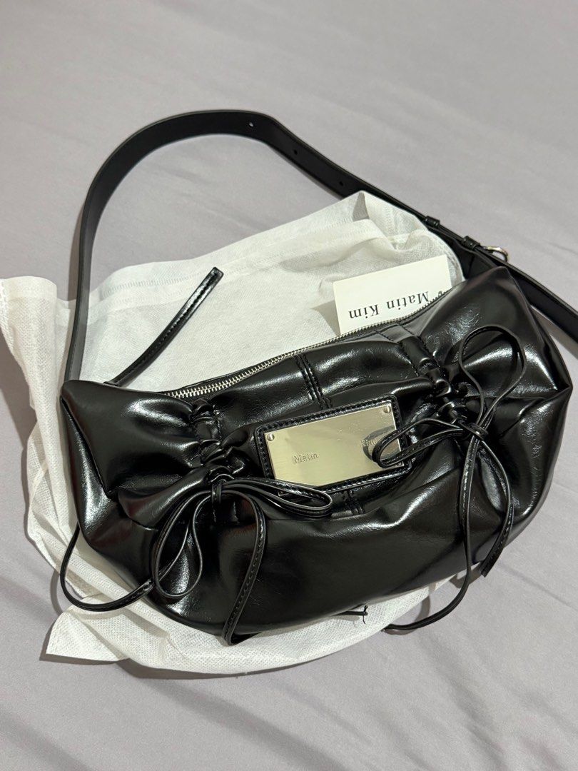 Black Bow Ribbon Coquette Bag (Category: Shoulder Bags) located in Malolos. Submitted by priothv (Listing ID 1414144118, Image 1). Description: - Glossy finish - Long, adjustable strap - Minimalist design - never used - DUPE only ‼️‼️‼️.