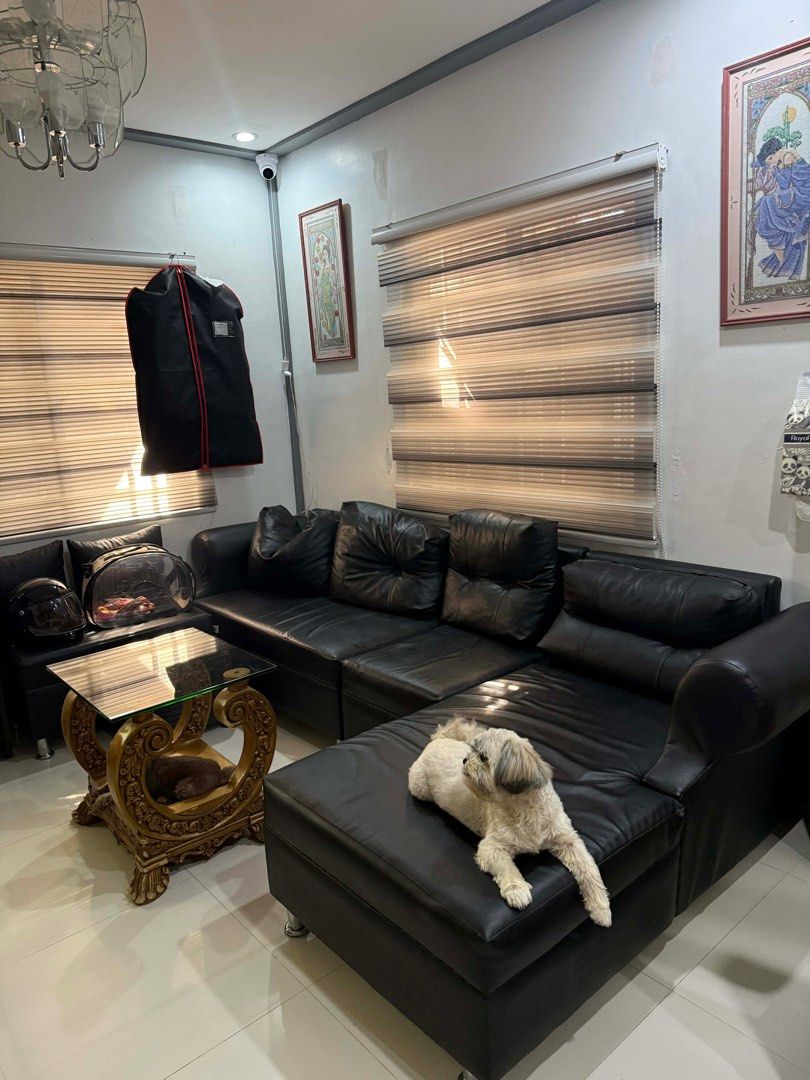 Black Leather Sectional Sofa (Category: Sofas) located in Bulacan. Submitted by shielamagd22715 (Listing ID 1414089282, Image 1). Description: - Black Pure leather sectional sofa with chaise lounge - Modern design with tufted cushions - Comes with a matching black leather ottoman - Well-maintained condition - Perfect for living room setup.