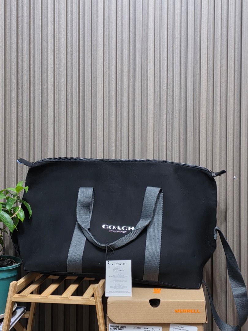 Coach Black Week-ender Travel Bag (Category: Luxury Bags & Wallets) located in General Santos City (Dadiangas). Submitted by wisedolphin-3dd2 (Listing ID 1414212898, Image 1). Description: - Authentic Coach Travel bag, very lightweight. - Secure zipper closure - Stylish gray shoulder adjustable strap, and Hand handle strap. - Features Coach logo on zipper pull and strap button - Polyester Lined interior - Includes original tag - Spacious design, 