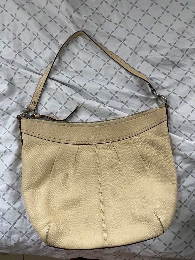 Coach Soho pleated hobo bag (Category: Luxury Bags & Wallets) located in Quezon City. Submitted by jmgordona (Listing ID 1414148535, Image 1). Description: Original, bought from US Has minimal stain but still in good condition. Needs exterior cleaning to remove the stain. Color: cream or light yellow pebbled leather Loc: QUEZON CITY.