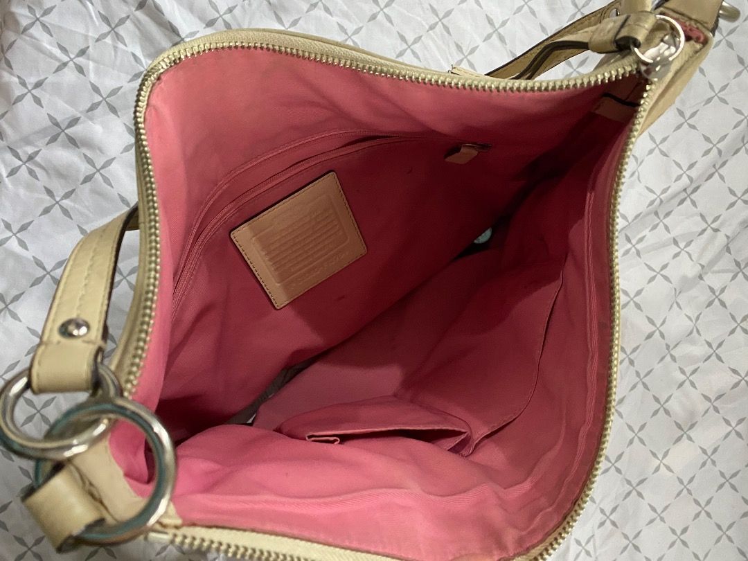 Coach Soho pleated hobo bag (Category: Luxury Bags & Wallets) located in Quezon City. Submitted by jmgordona (Listing ID 1414148535, Image 3). Description: Original, bought from US Has minimal stain but still in good condition. Needs exterior cleaning to remove the stain. Color: cream or light yellow pebbled leather Loc: QUEZON CITY.