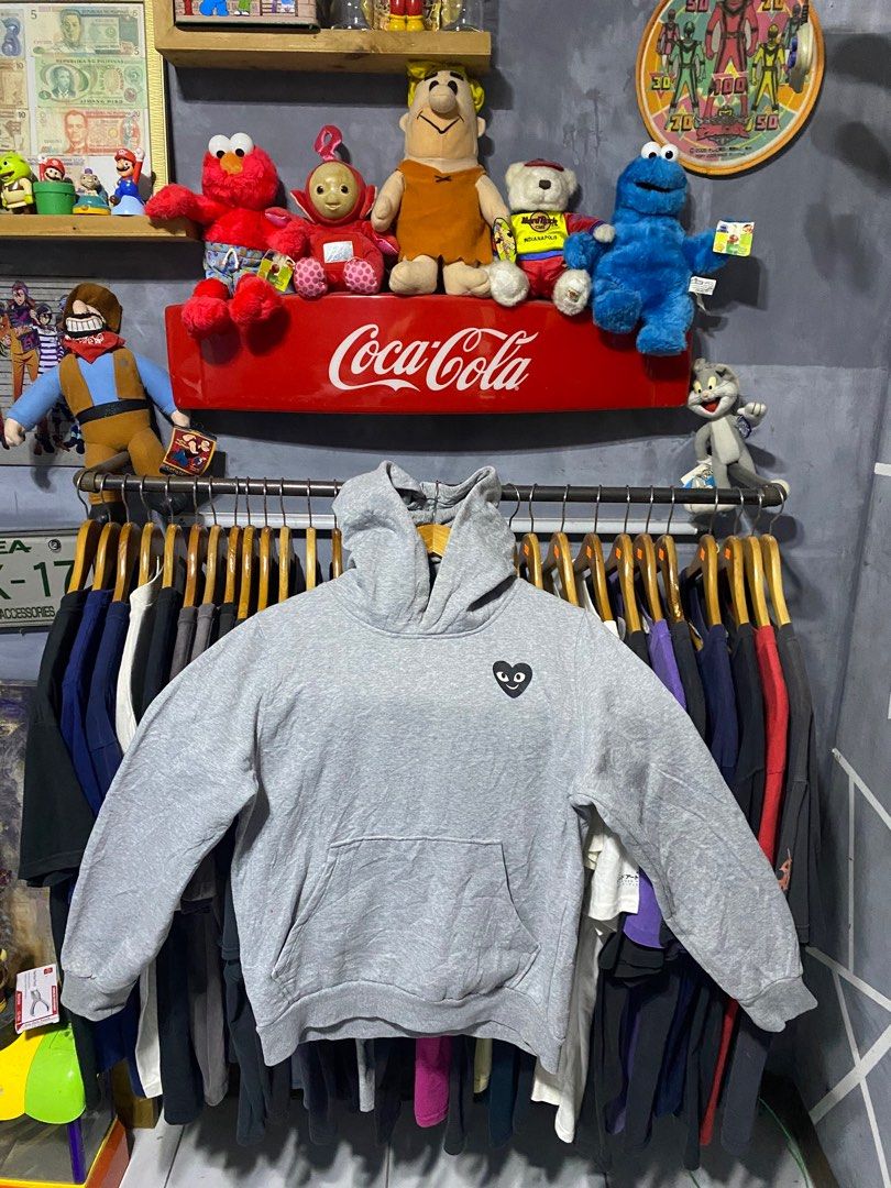Comme des Garcons Play Hoodie (Category: Luxury Apparel) located in Santa Ana. Submitted by tunes_vtg (Listing ID 1414162773, Image 1). Description: - Comme des Garcons Play hoodie - Size: Xl Women medium Men - Iconic heart logo on front - Graphic print on back - Features a hood and kangaroo pocket - Made of 100% cotton - Brand and size tag present - Excellent Condition - Issue Minimal lints not visible at all - Complete Tags - Dimes:L25xW21 ₱550