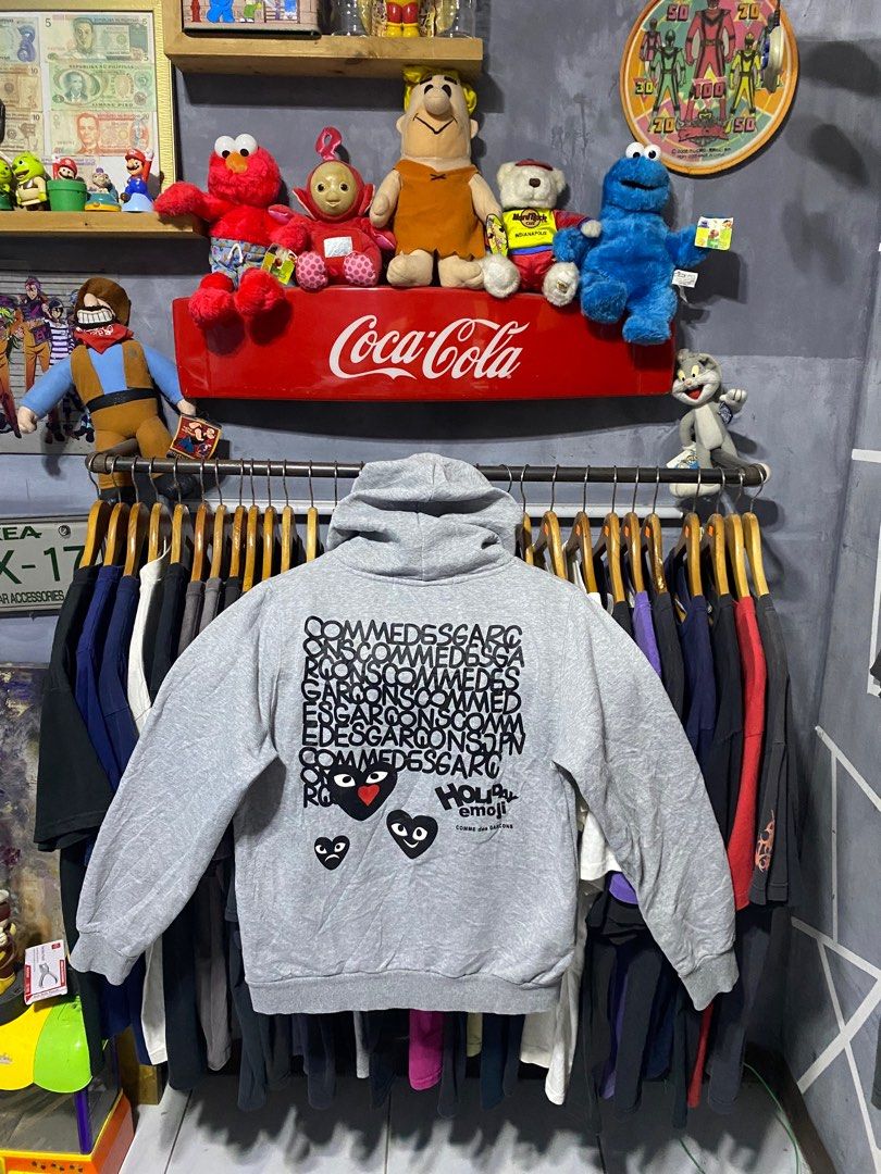 Comme des Garcons Play Hoodie (Category: Luxury Apparel) located in Santa Ana. Submitted by tunes_vtg (Listing ID 1414162773, Image 2). Description: - Comme des Garcons Play hoodie - Size: Xl Women medium Men - Iconic heart logo on front - Graphic print on back - Features a hood and kangaroo pocket - Made of 100% cotton - Brand and size tag present - Excellent Condition - Issue Minimal lints not visible at all - Complete Tags - Dimes:L25xW21 ₱550