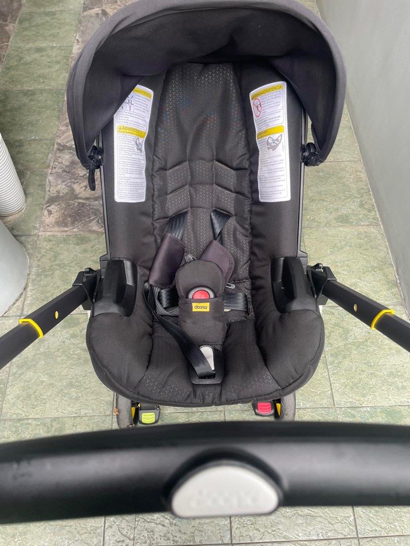 Doona Infant Stroller/Car Seat - Nitro Black (Category: Strollers) located in Marikina City. Submitted by ninscan (Listing ID 1414093965, Image 3). Description: - Doona Infant Stroller/Car Seat in Nitro Black - Black seat with canopy - Five-point harness for safety - Easy to maneuver with handle and wheels - Doona logo visible - Minimal use only for 4 months - Reason for selling: family moving to US and will not bring this stroller, purchased las