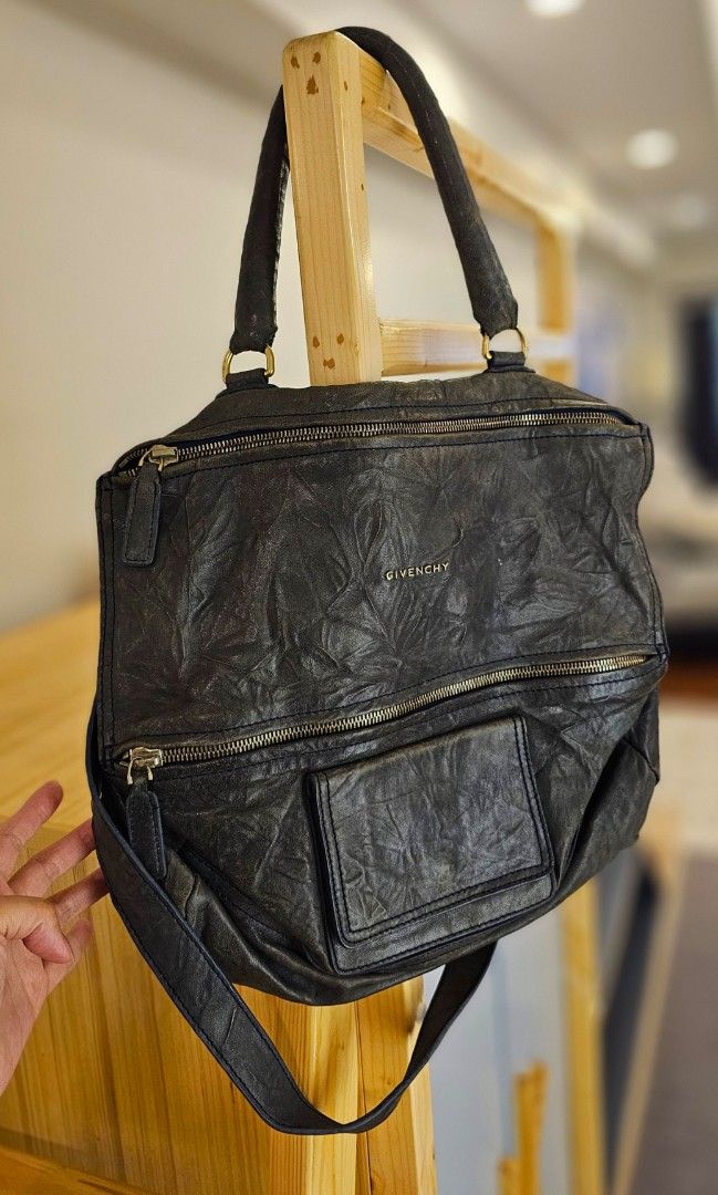 Givenchy Pandora Handbag (Category: Luxury Bags & Wallets) located in Makati City. Submitted by mrsdm (Listing ID 1414106961, Image 2). Description: - Black Givenchy Antigona handbag - Top handle and detachable shoulder strap - Two zippered compartments - Front pocket - Givenchy logo detail - Textured finish.