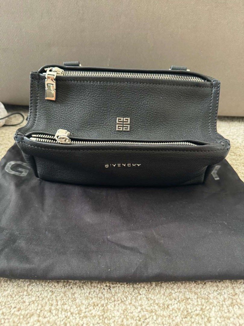 Givenchy Pandora Mini (Category: Luxury Bags & Wallets) located in Manila. Submitted by _anjdecluttermnl21 (Listing ID 1414154850, Image 1). Description: - Authentic Givenchy Pandora Mini Bag - Color: Black - Features: - Top zipper closure - Front zipper pocket - Silver-tone hardware - Givenchy logo on front - Includes dust bag.