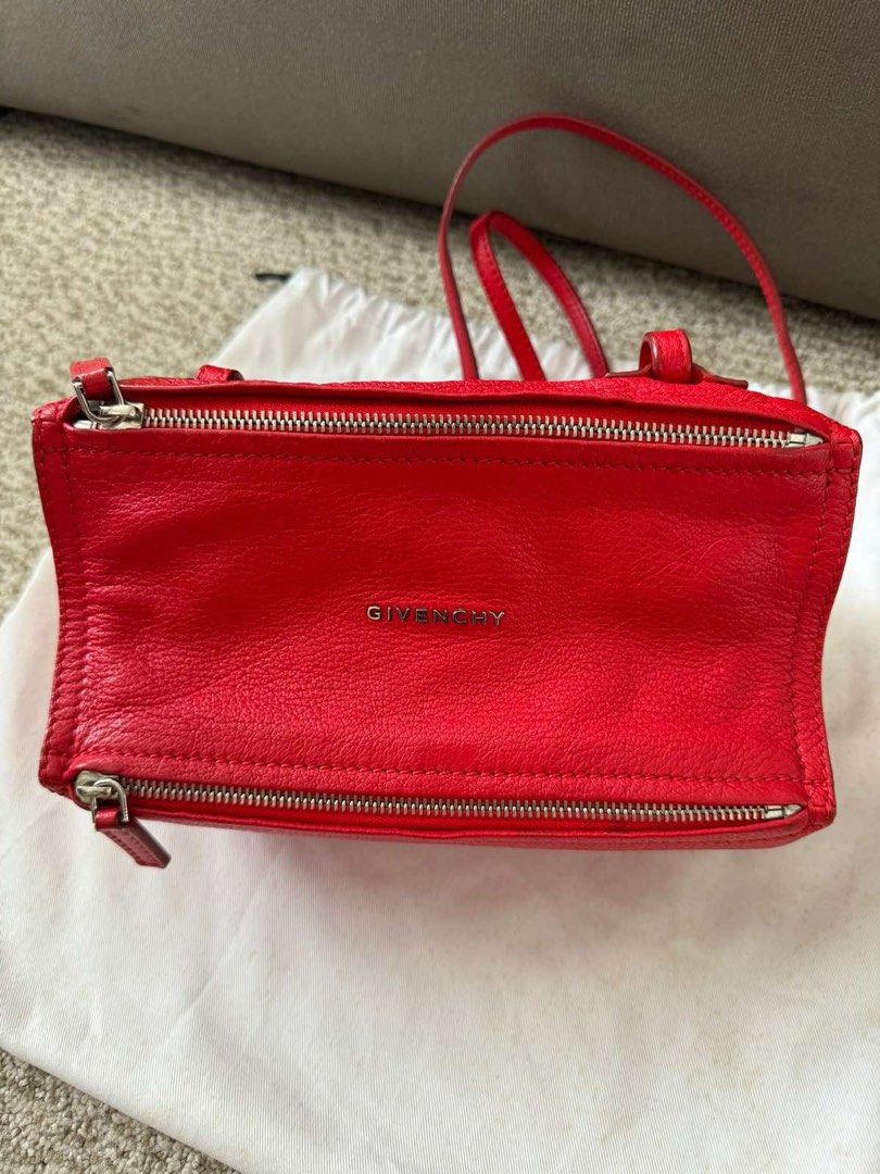 Givenchy Pandora Mini Bag - Red (Category: Luxury Bags & Wallets) located in Manila. Submitted by _anjdecluttermnl21 (Listing ID 1414154741, Image 1). Description: - Authentic Givenchy Pandora Mini bag - Color: Red - Features a top handle and shoulder strap - Two zippered compartments - Givenchy logo visible - Includes dust bag - Perfect for everyday use.