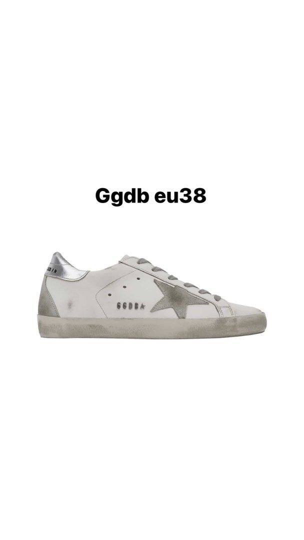Golden Goose Ggdb Sneakers EU38 (Category: Sneakers) located in Paranaque City. Submitted by MDPE_TRADING (Listing ID 1414166015, Image 1). Description: - Golden Goose GGDB sneakers - White with silver star detail - Size: EU38 - Distressed design - Lace-up closure - Rubber sole - Golden Goose logo visible.