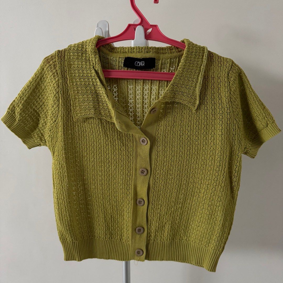 Green Knit Cardigan Top (Category: Blouses) located in Manila. Submitted by declutterzoneee (Listing ID 1414105596, Image 1). Description: - Green knit cardigan top - Short sleeves - Collared neckline - Button-down front - Textured knit - Branded - Versatile style.