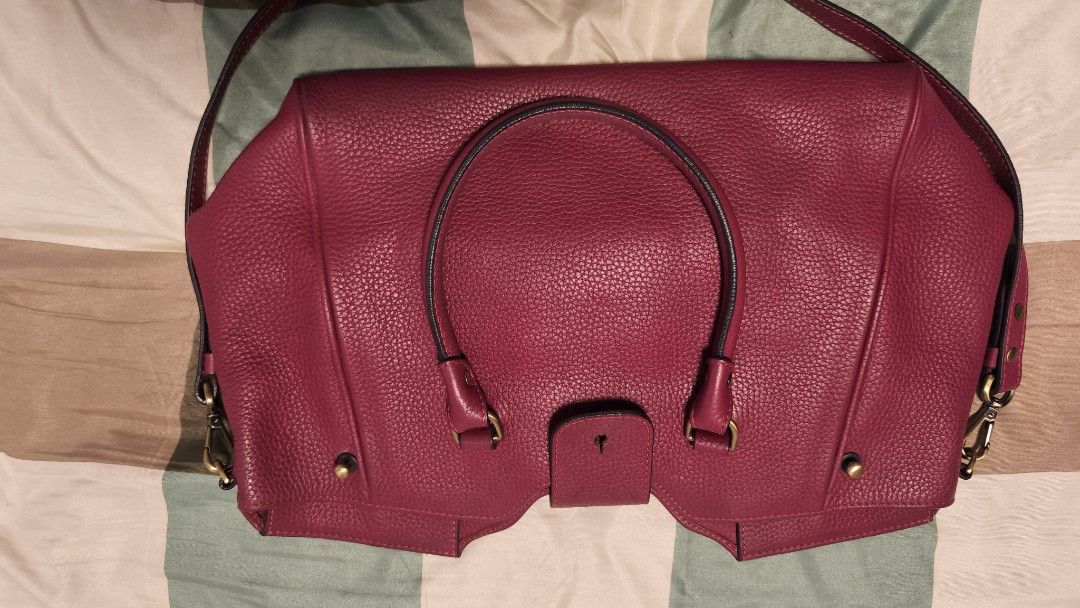 Fino Red Leather Handbag (Category: Luxury Bags & Wallets) located in Manila. Submitted by decutteringbyjel (Listing ID 1414087186, Image 3). Description: - Elevate your look with this Classy Red Fino handbag - Really good condition - Top handle and detachable shoulder strap - Flap closure with lock - Interior zippered pocket - Textured leather - Gold-toned hardware - Structured shape Bundle: free any item of your choice that is under 1k..