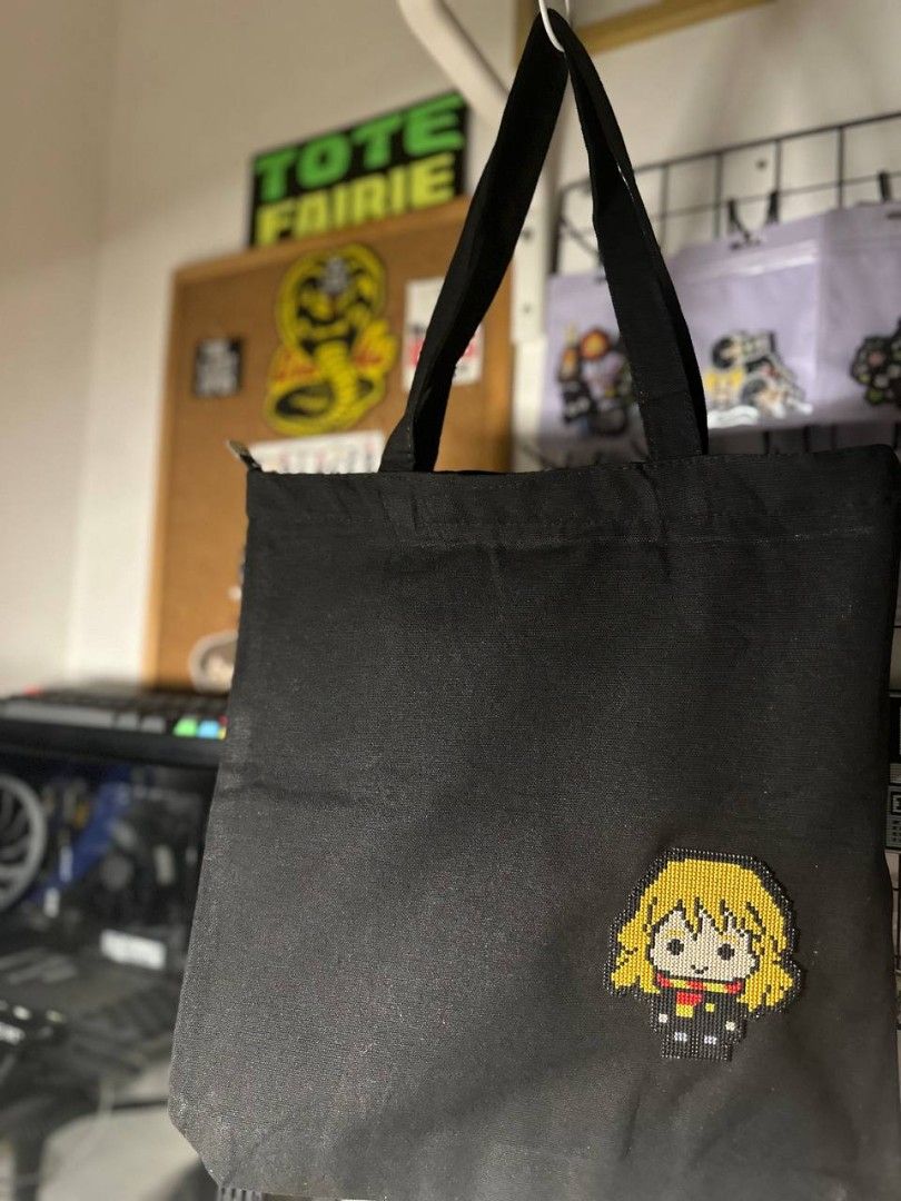 Hermione Granger Tote Bag (Category: Tote Bags) located in Imus. Submitted by t0t3fairi3 (Listing ID 1414118244, Image 1). Description: Black tote bag featuring Hermione Granger cross stitch patch handmade with imported DMC threads and plastic canvass. It is a simple, functional bag suitable for carrying various items..