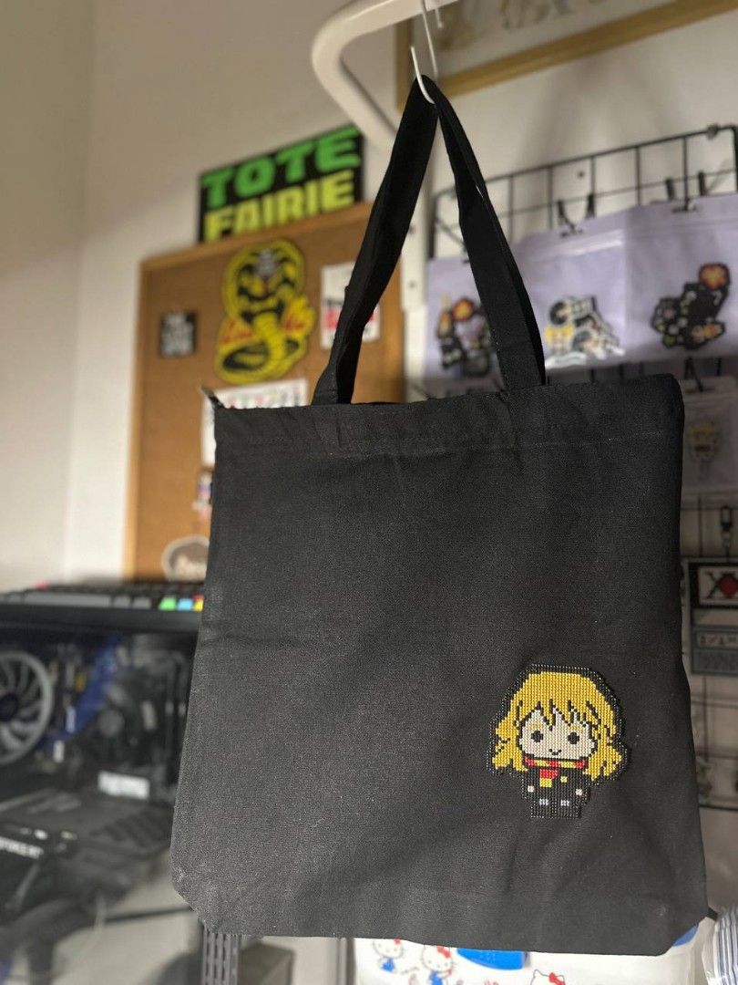 Hermione Granger Tote Bag (Category: Tote Bags) located in Imus. Submitted by t0t3fairi3 (Listing ID 1414118244, Image 2). Description: Black tote bag featuring Hermione Granger cross stitch patch handmade with imported DMC threads and plastic canvass. It is a simple, functional bag suitable for carrying various items..