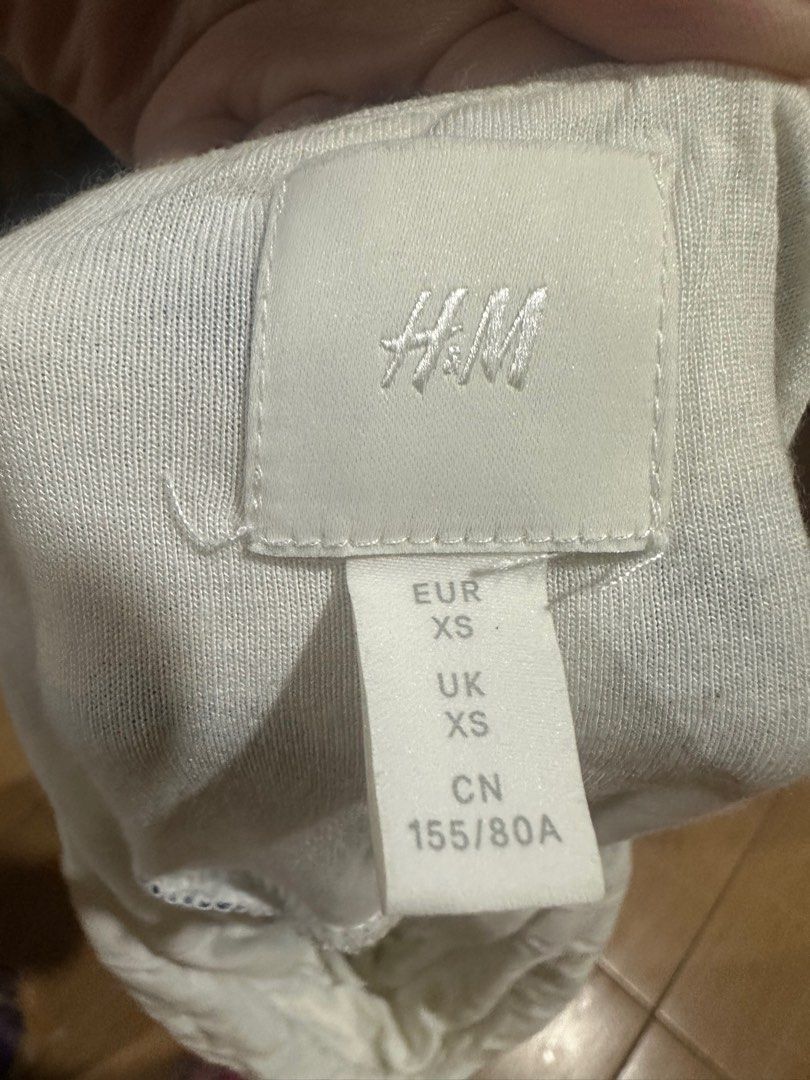H&M DRESS (Category: Dresses) located in Baguio. Submitted by zafispicks (Listing ID 1414210380, Image 2). Description: - H&M mini dress - Size: XS - Color: White with navy blue polka dots - Design: Twisted bust detail, spaghetti straps - Style: Casual.