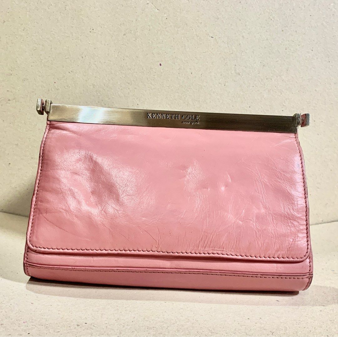 Kenneth Cole New York Pink Handbag (Category: Luxury Bags & Wallets) located in Mandaue City. Submitted by maxguiller89260 (Listing ID 1414224963, Image 1). Description: Kenneth Cole Clutch bag/Mini Shoulder Bag Removable shoulder strap to convert into a clutch purse. Light Pink KC on fastener strap Minor rusting on inside button but is not causing issues Material appears used but in great condition for a decade collected item. Owner left for Ger