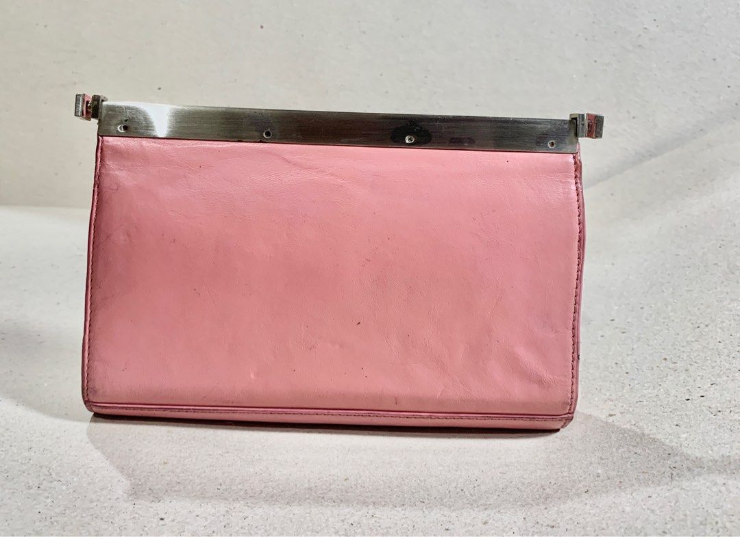 Kenneth Cole New York Pink Handbag (Category: Luxury Bags & Wallets) located in Mandaue City. Submitted by maxguiller89260 (Listing ID 1414224963, Image 3). Description: Kenneth Cole Clutch bag/Mini Shoulder Bag Removable shoulder strap to convert into a clutch purse. Light Pink KC on fastener strap Minor rusting on inside button but is not causing issues Material appears used but in great condition for a decade collected item. Owner left for Ger