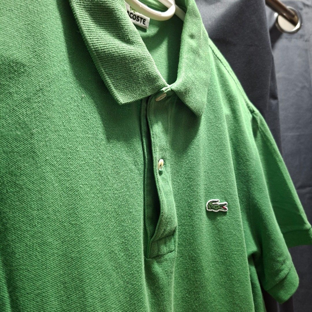 Lacoste Green Polo Shirt (Category: Tshirts & Polo Shirts ) located in Makati City. Submitted by kenan.g (Listing ID 1414122842, Image 2). Description: - Green Lacoste polo shirt - Size 4 (Medium) - Features the iconic crocodile logo - Classic polo collar and two-button placket - Made of pique fabric - Versatile for everyday wear Price: PHP 380.00 (shipping fee not included).