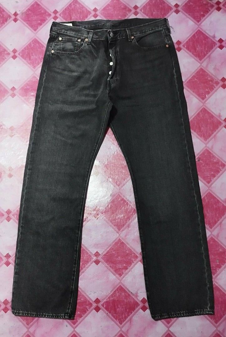 Levi's 501 Jeans - Black (Category: Jeans) located in Manila. Submitted by esparciake75752 (Listing ID 1414076370, Image 2). Description: - Levi's 501 jeans in black - Size: W38 L34 - Straight leg fit - Button fly - Classic five-pocket design - Features the iconic Levi's red tab - Made from durable denim - Includes a leather patch at the back.