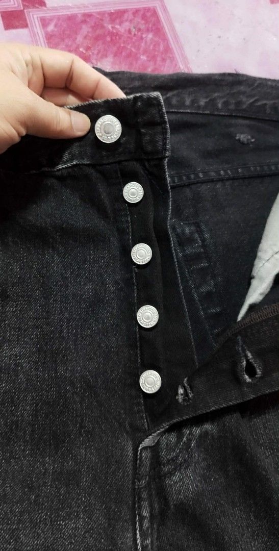 Levi's 501 Jeans - Black (Category: Jeans) located in Manila. Submitted by esparciake75752 (Listing ID 1414076370, Image 3). Description: - Levi's 501 jeans in black - Size: W38 L34 - Straight leg fit - Button fly - Classic five-pocket design - Features the iconic Levi's red tab - Made from durable denim - Includes a leather patch at the back.