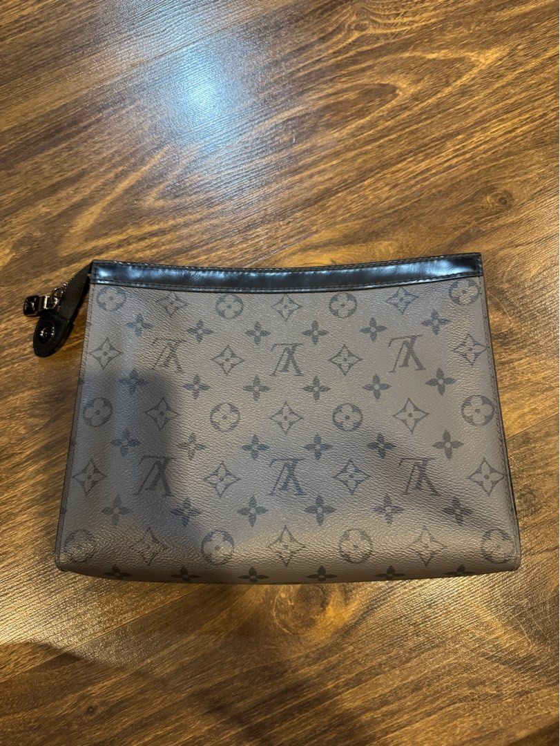 Louis Vuitton Monogram Eclipse Clutch (Category: Luxury Bags & Wallets) located in Muntinlupa City. Submitted by myabcshop (Listing ID 1414234232, Image 1). Description: - Authentic Louis Vuitton Monogram Eclipse clutch - Features the iconic dark grey monogram pattern - Black interior with multiple compartments - Includes a wrist strap - Serial number: FN4250 - Made in Spain 💯 ORIGINAL AND AUTHENTIC.