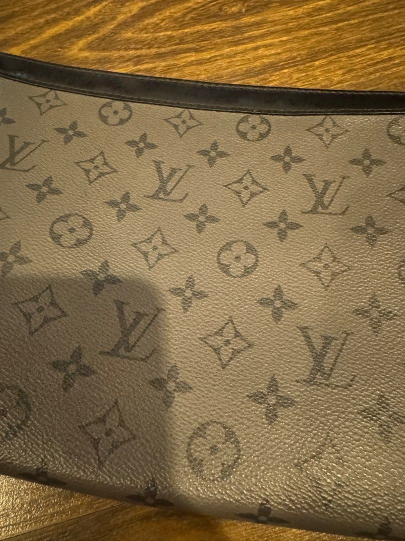 Louis Vuitton Monogram Eclipse Clutch (Category: Luxury Bags & Wallets) located in Muntinlupa City. Submitted by myabcshop (Listing ID 1414234232, Image 3). Description: - Authentic Louis Vuitton Monogram Eclipse clutch - Features the iconic dark grey monogram pattern - Black interior with multiple compartments - Includes a wrist strap - Serial number: FN4250 - Made in Spain 💯 ORIGINAL AND AUTHENTIC.