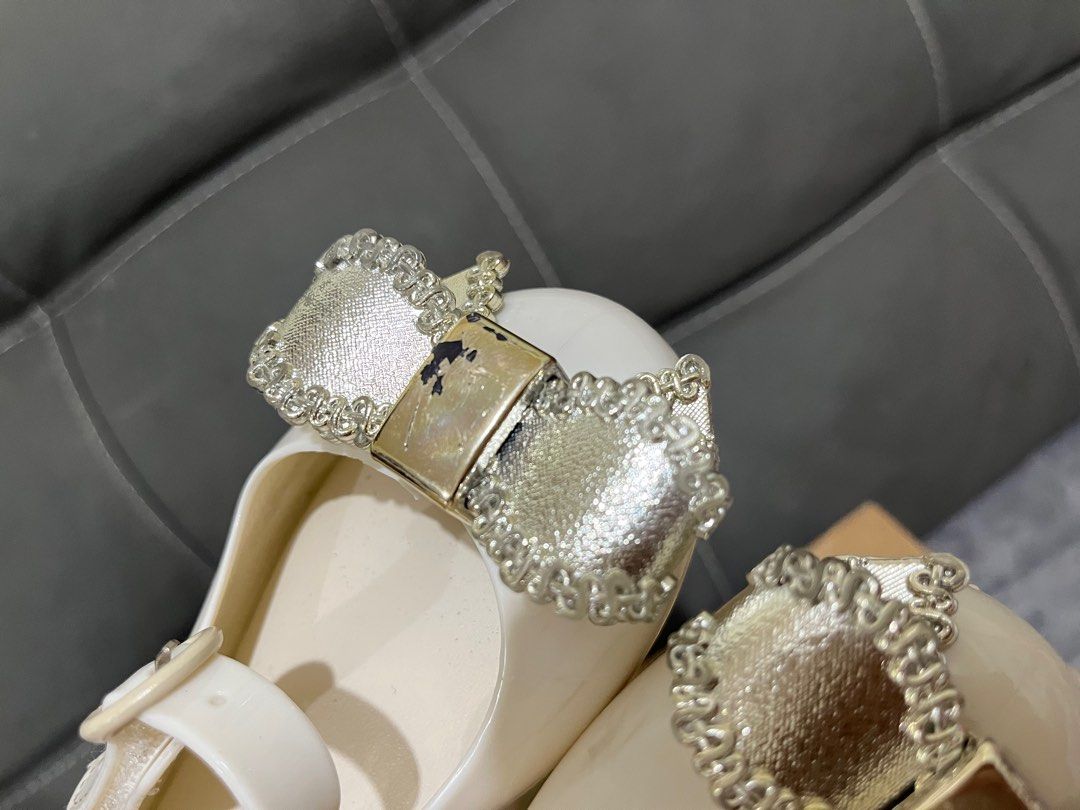 Mini Melissa - not Auth. size 9 (16cm) (Category: Babies & Kids Fashion) located in Dagupan City. Submitted by keziahiyah (Listing ID 1414211621, Image 3). Description: - Mini Melissa shoes in white - Adorned with a bow - Size 9 - Features a buckle closure - Comes with the original box - Made in Brazil - Soles show some wear.