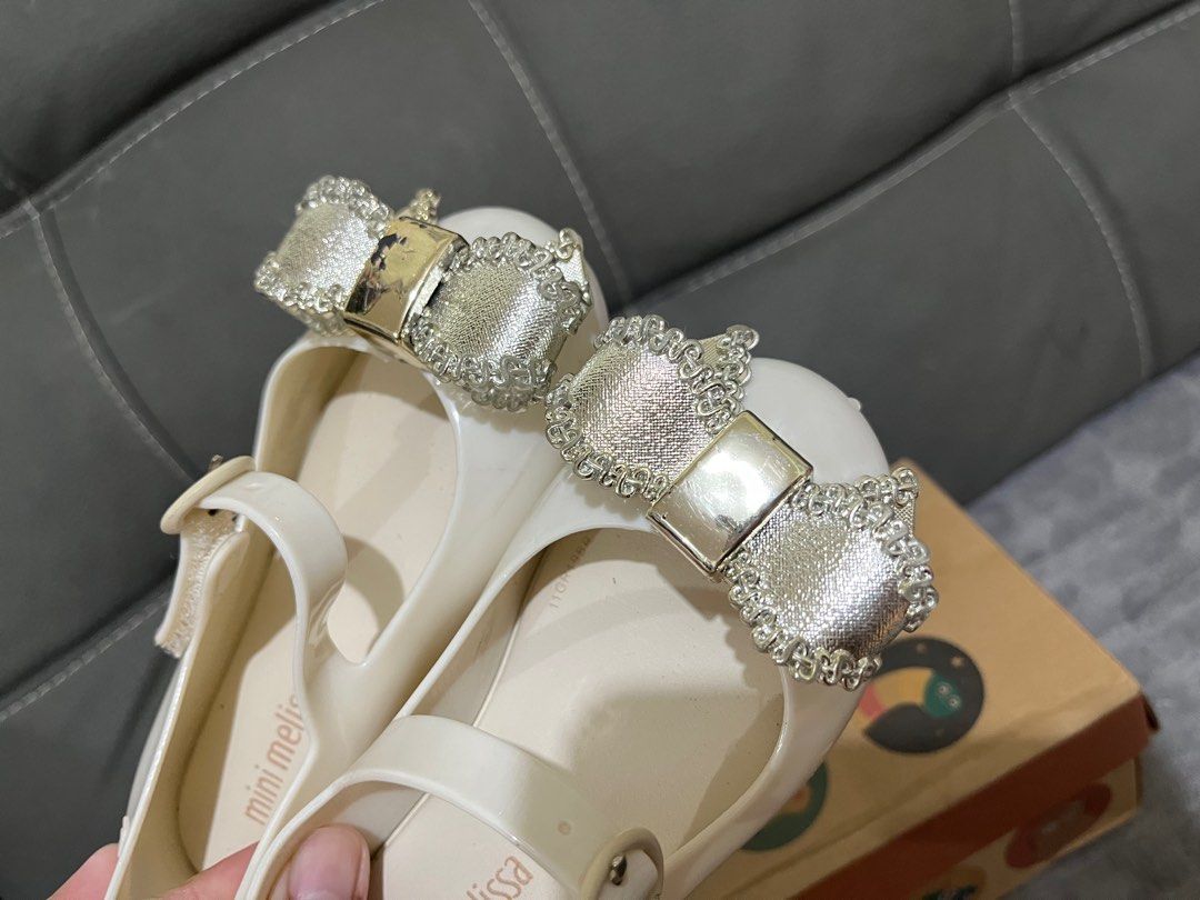 Mini Melissa - not Auth. size 9 (16cm) (Category: Babies & Kids Fashion) located in Dagupan City. Submitted by keziahiyah (Listing ID 1414211621, Image 2). Description: - Mini Melissa shoes in white - Adorned with a bow - Size 9 - Features a buckle closure - Comes with the original box - Made in Brazil - Soles show some wear.