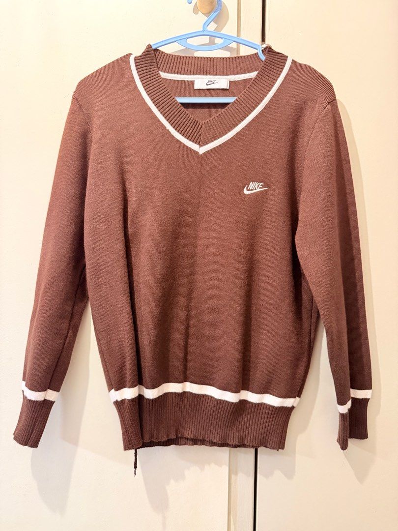 Nike Brown V-Neck Sweater and Pants Set (Category: Sets or Coordinates) located in Singapore. Submitted by blackvelma (Listing ID 1414206028, Image 1). Description: - Nike sweater and pants set - Sweater: V-neck design with white trim - Features Nike logo - Pants: White stripe down the side - Perfect for a casual, sporty look.