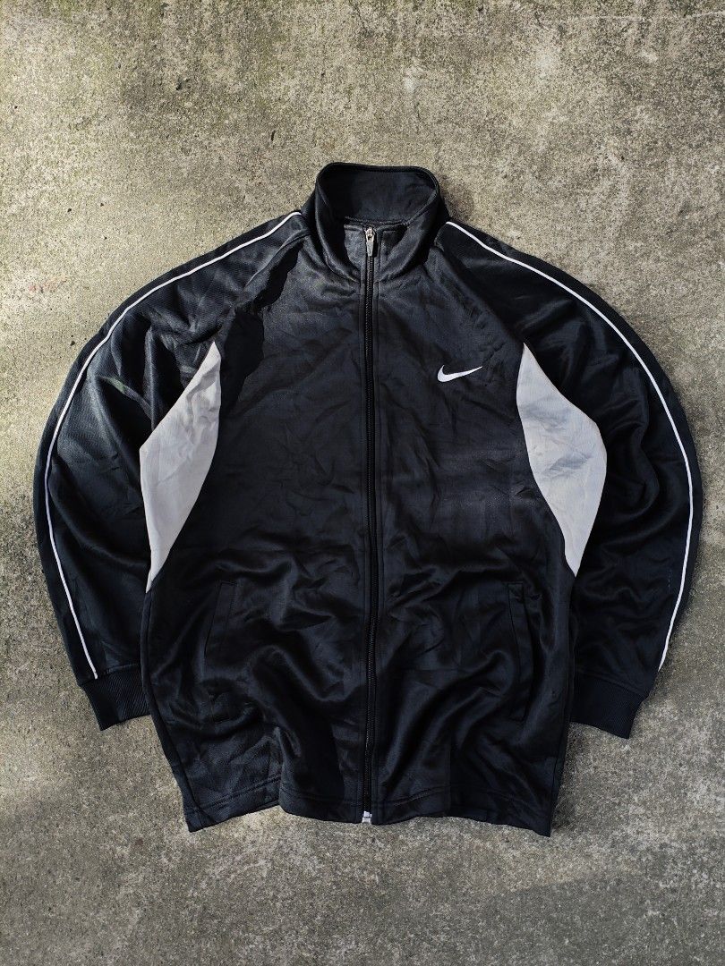 NIKE FULL ZIP EMBROIDERED SWOOSH TRACK JACKET (Category: Coats, Jackets and Outerwear) located in Cavite. Submitted by grailedthings_ (Listing ID 1414139019, Image 1). Description: NIKE FULL ZIP EMBROIDERED SWOOSH TRACK JACKET 21x27 EXCELLENT CONDITION NO ISSUE.